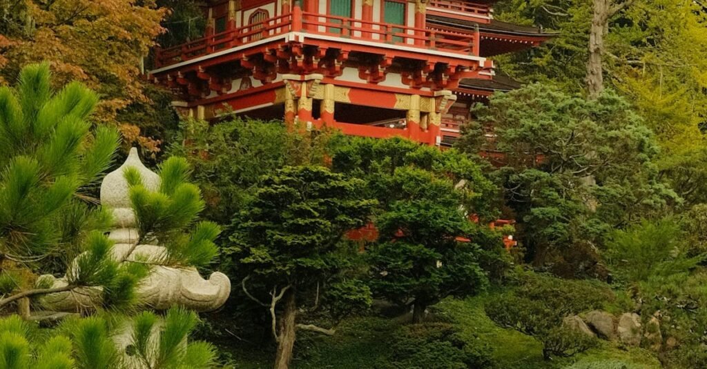 A vibrant Japanese structure surrounded by lush greenery in San Francisco.