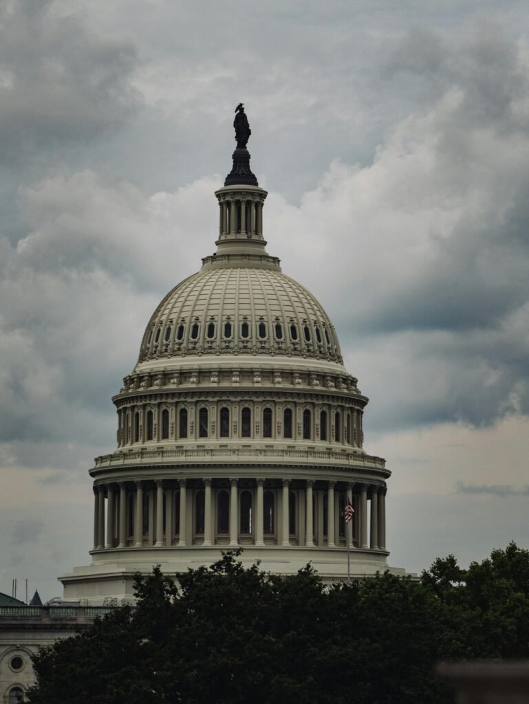 Dramatic cloudy sky over the iconic United States Capitol Dome in Washington, D.C.