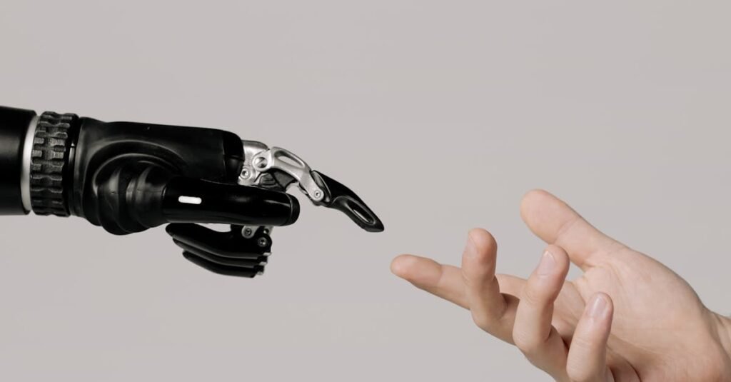 A human hand reaching to touch a bionic prosthetic hand on a white background.