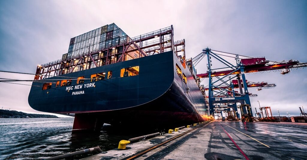 A large cargo ship docked at Gothenburg port with industrial cranes, Sweden.